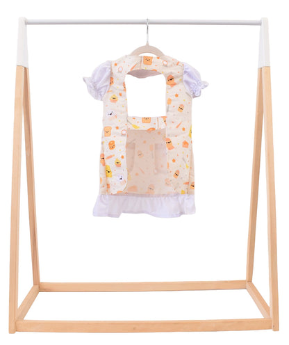Lil' Foodee Lil Baker puff-sleeve apron in pastel baking print with cupcakes, whisks and sprinkles.