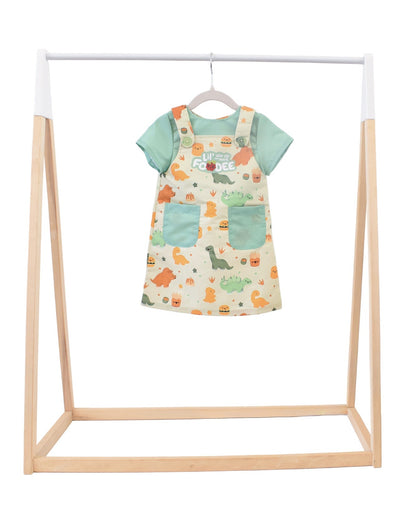 Lil' Foodee Dino Munch everyday apron featuring teal dinosaur print, simple fit and wipe-clean fabric.