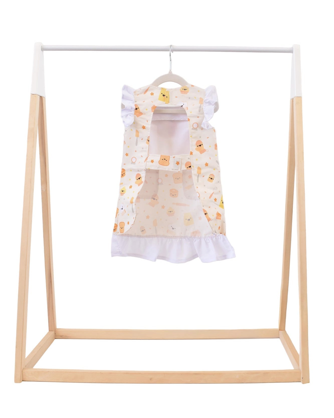 Lil' Foodee Lil Baker frill apron featuring pastel baking icons and ruffled edges.