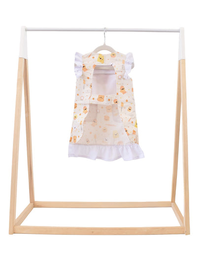 Lil' Foodee Lil Baker frill apron featuring pastel baking icons and ruffled edges.