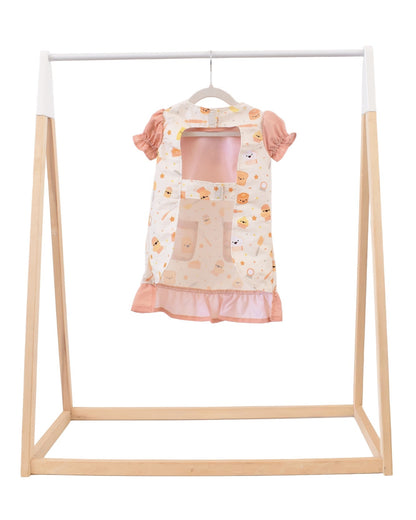 Lil' Foodee Lil Baker puff-sleeve apron in pastel baking print with cupcakes, whisks and sprinkles.