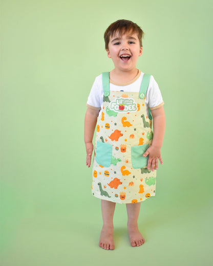 Lil' Foodee Dino Munch classic apron with teal dinosaur design and magnetic closures.