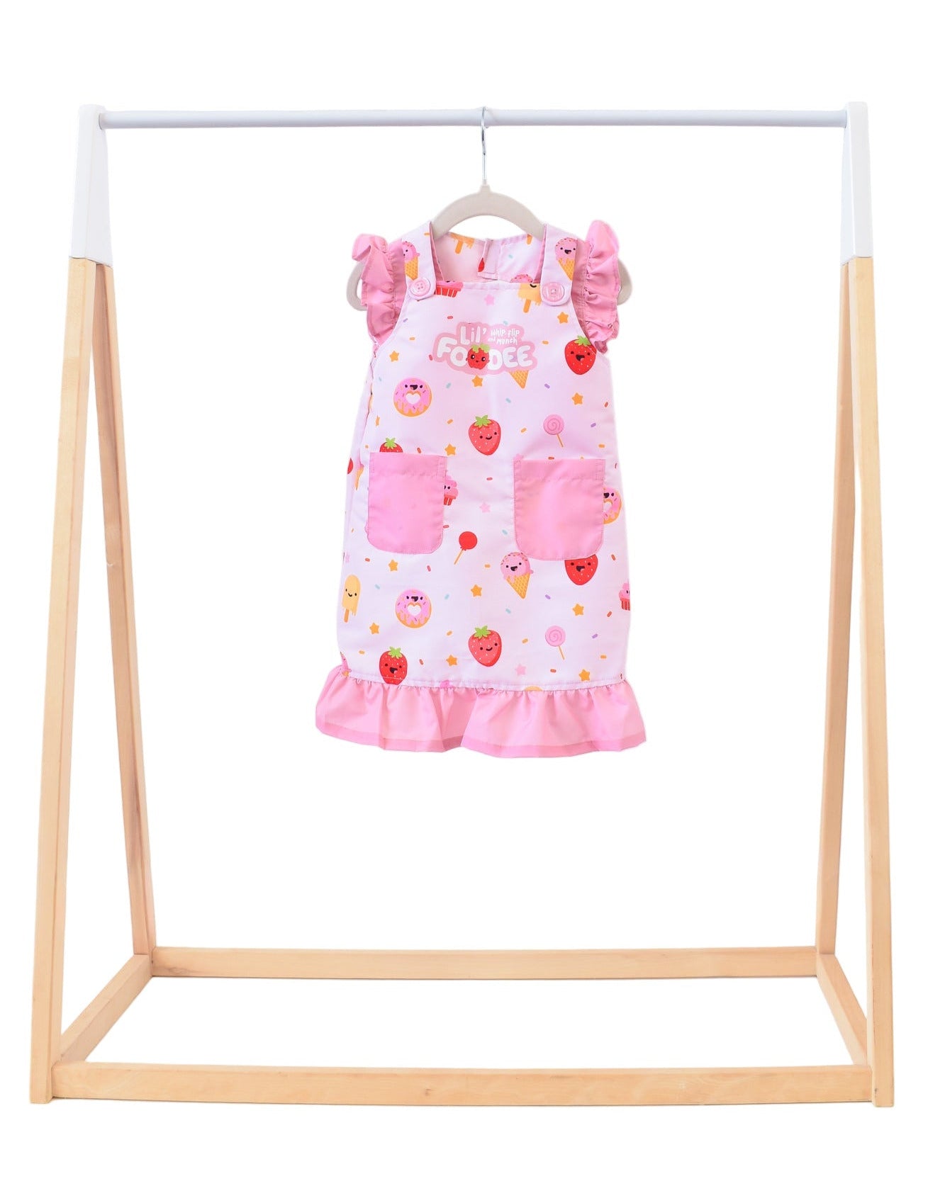 Lil' Foodee Strawberry Sprinkles frill apron featuring pink strawberry pattern and sweet ruffle trim.