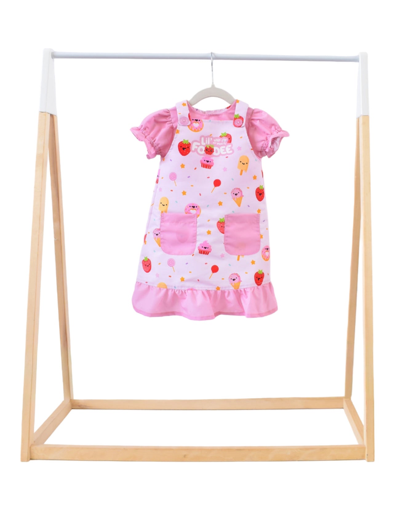 Lil' Foodee Strawberry Sprinkles puff-sleeve apron with pink strawberry print and full-coverage puff sleeves.