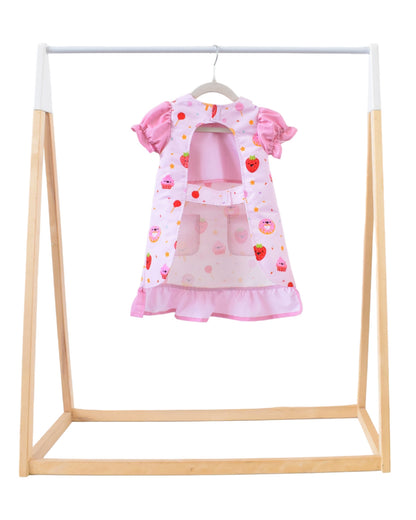 Lil' Foodee Strawberry Sprinkles puff-sleeve apron with pink strawberry print and full-coverage puff sleeves.